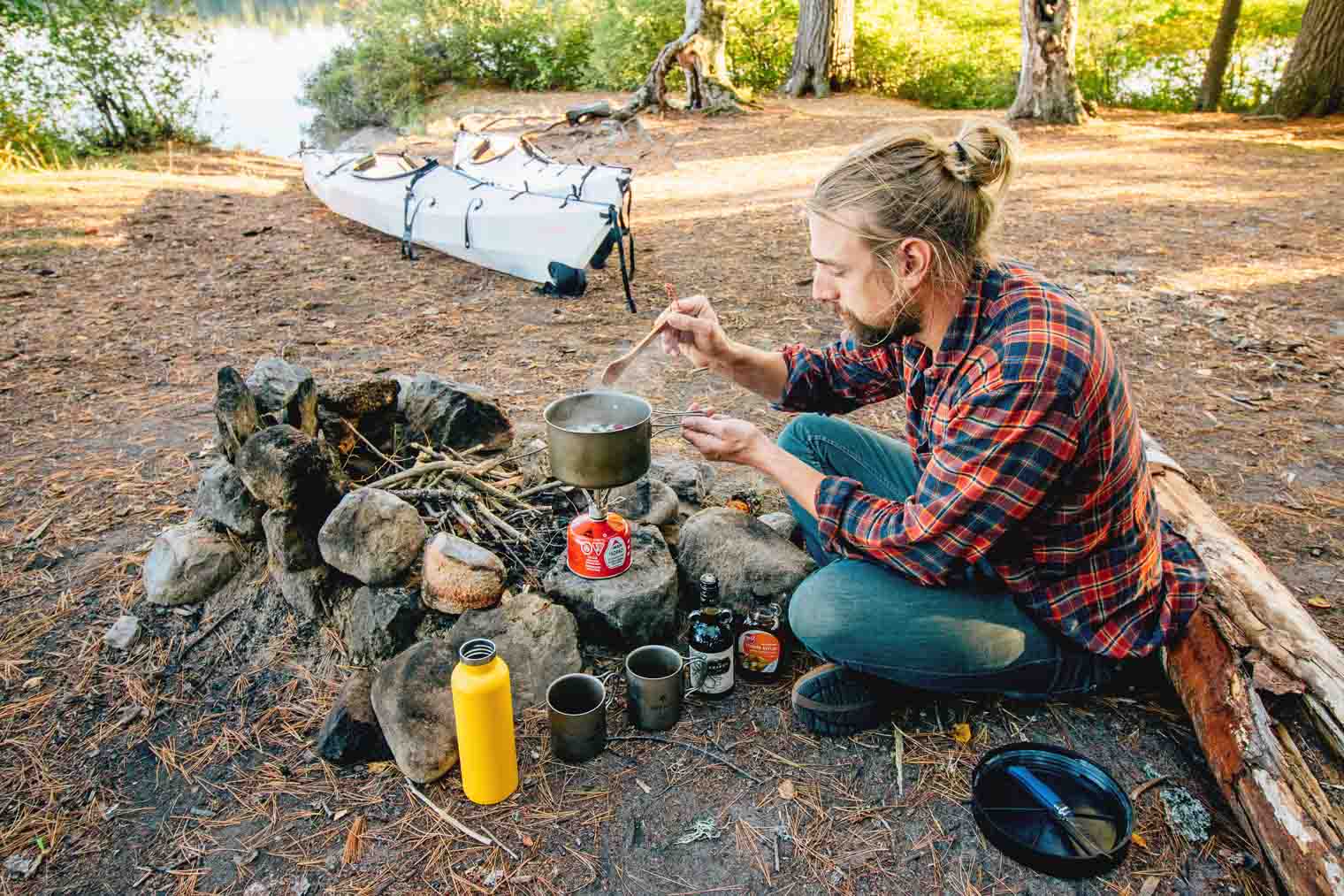 Michael cooking over a campfire