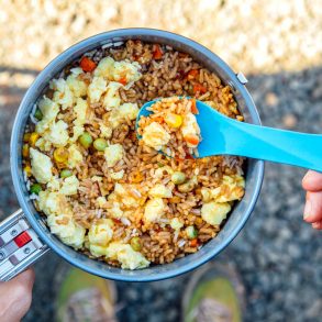 Megan holding backpacking fried rice in a pot