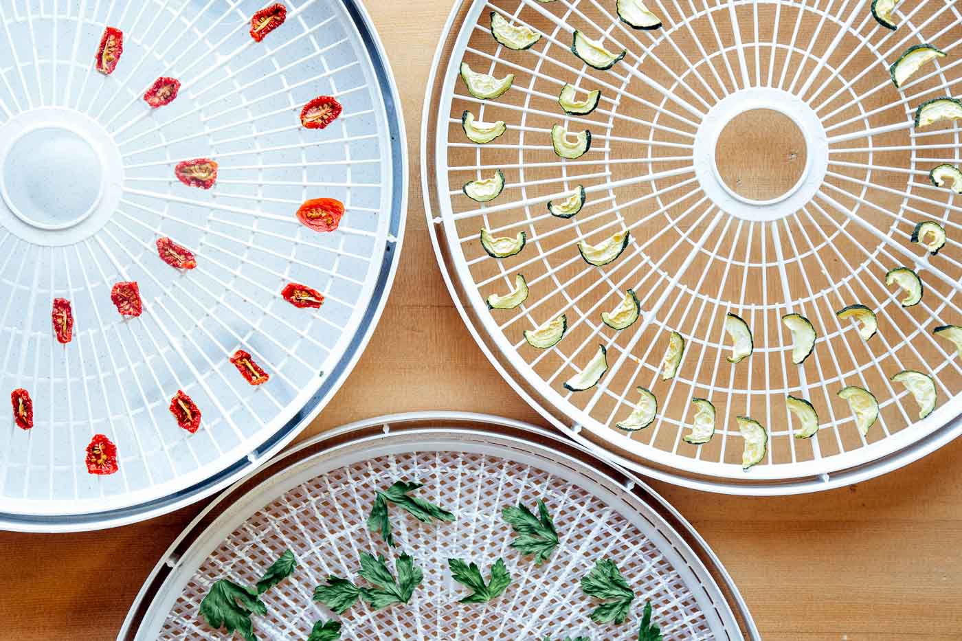 Dehydrator trays with dried vegetables