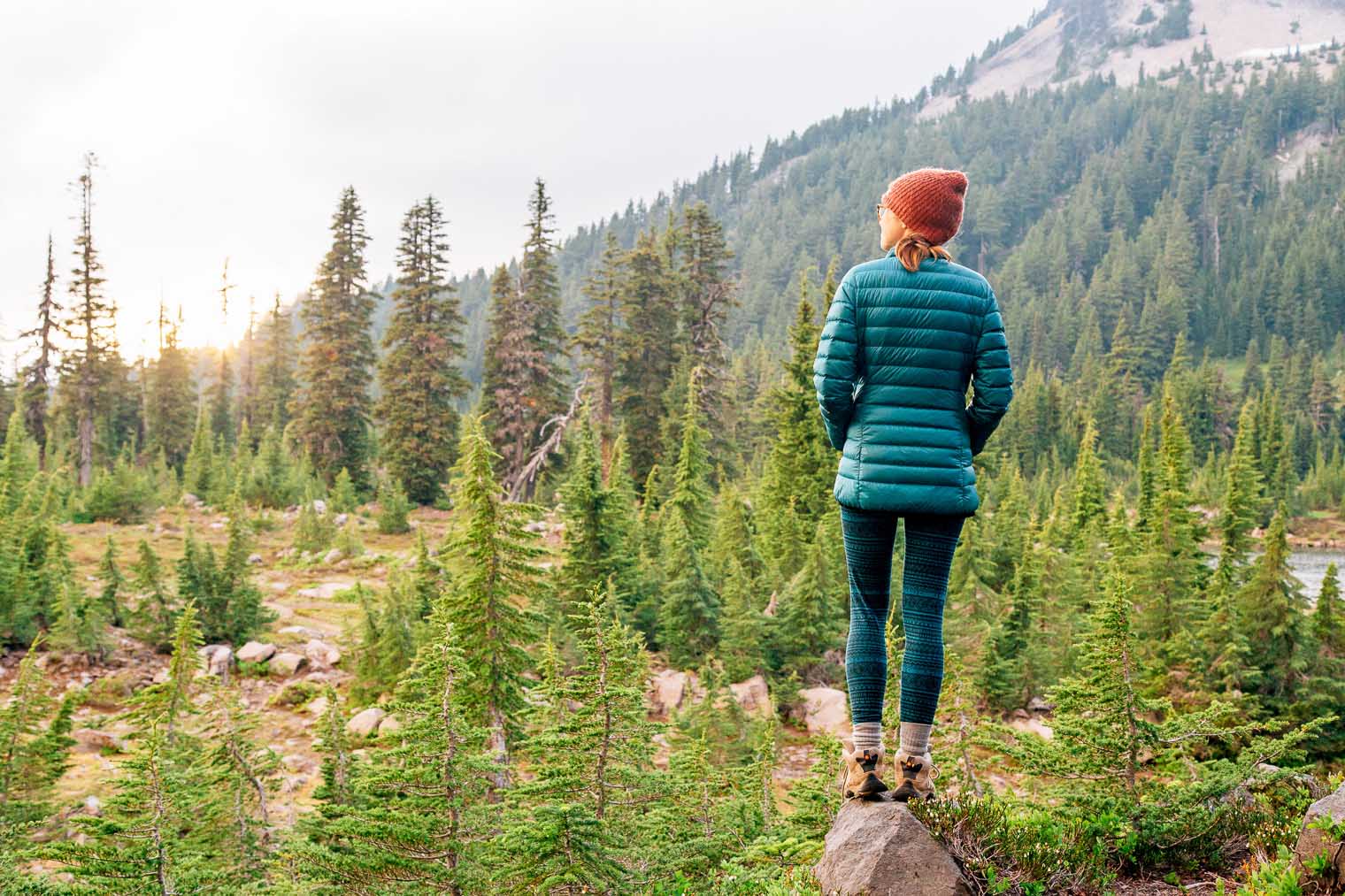 Megan standing on a rock looking at Mount Jefferson