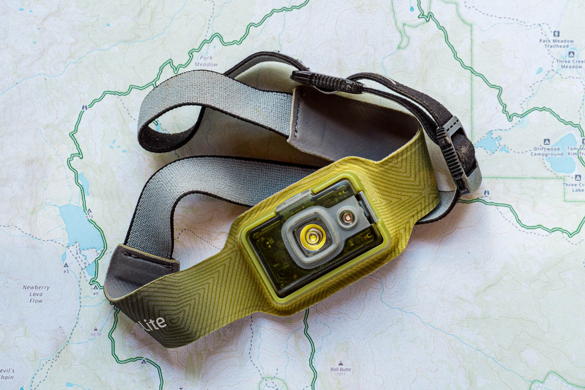 A green headlamp displayed on a trail map