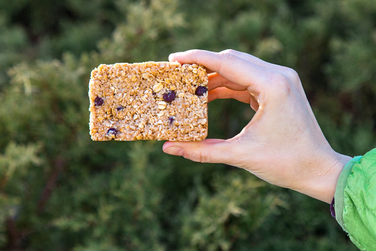 Megan holding up a granola bar to demonstrate that it holds together