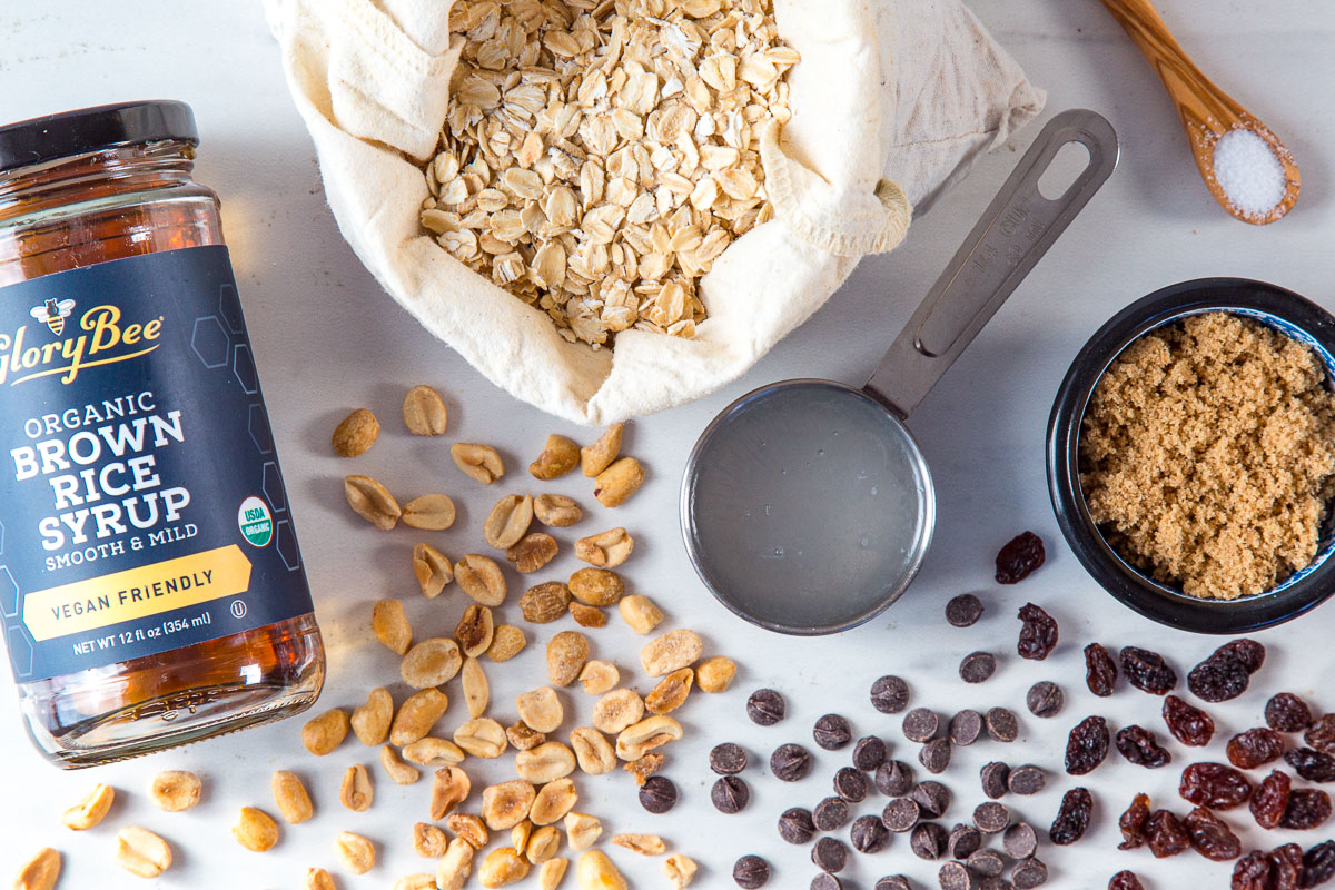 Granola bar ingredients: Rolled oats, brown rice syrup, coconut oil, brown sugar, peanuts, chocolate chips, and raisins