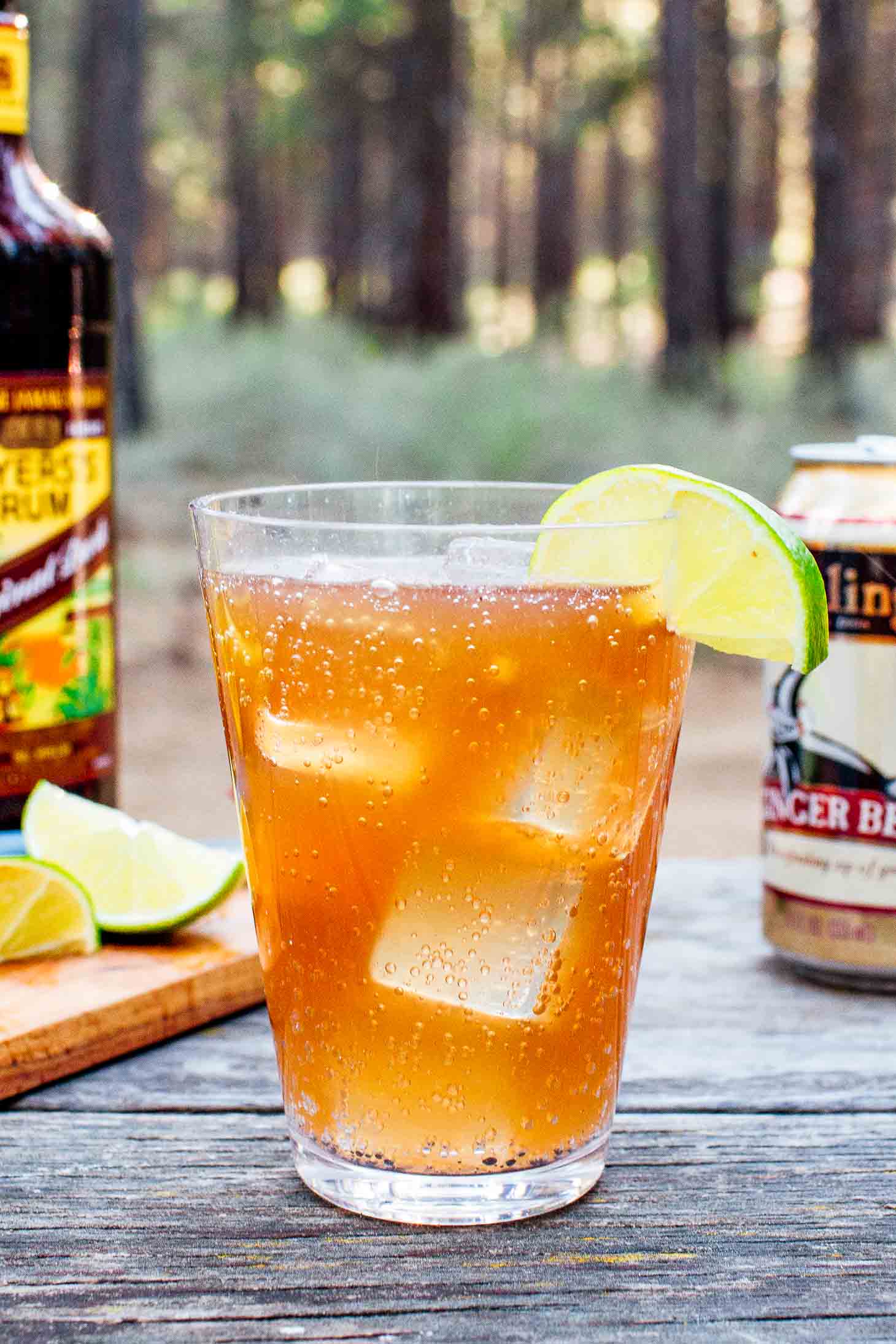 Dark and stormy with a can of ginger beer and rum bottle in the background