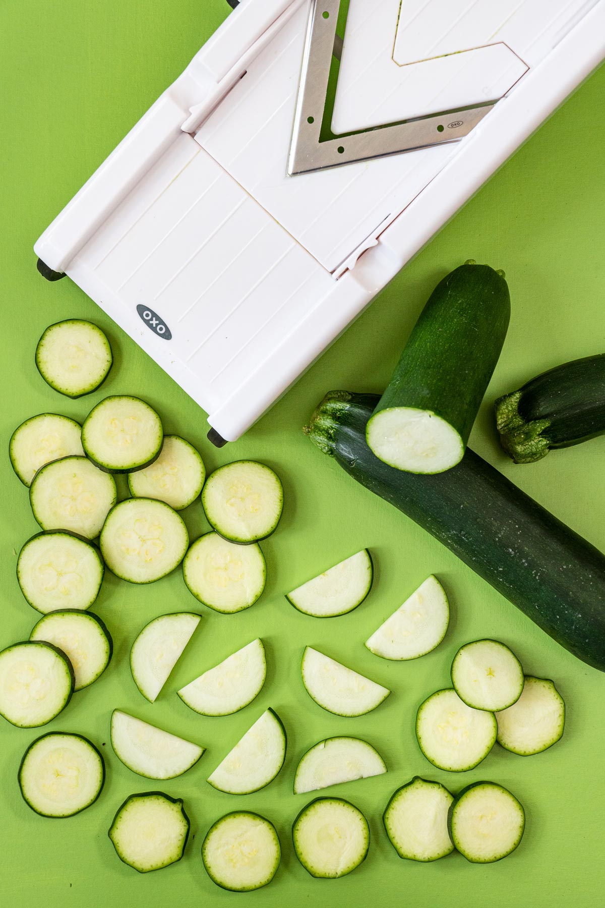 Slicing zucchini with a mandoline