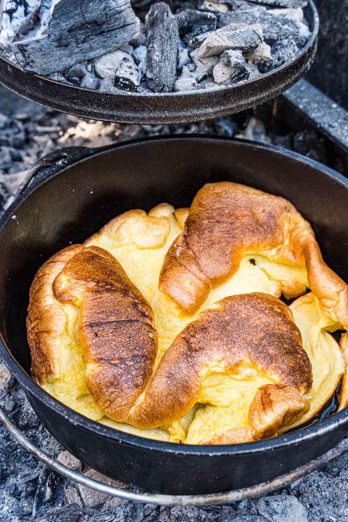 A Dutch baby puffed up in a dutch oven