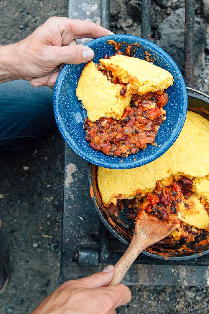 Serving chili and cornbread from a Dutch oven