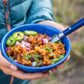 Megan holding a bowl of chili mac