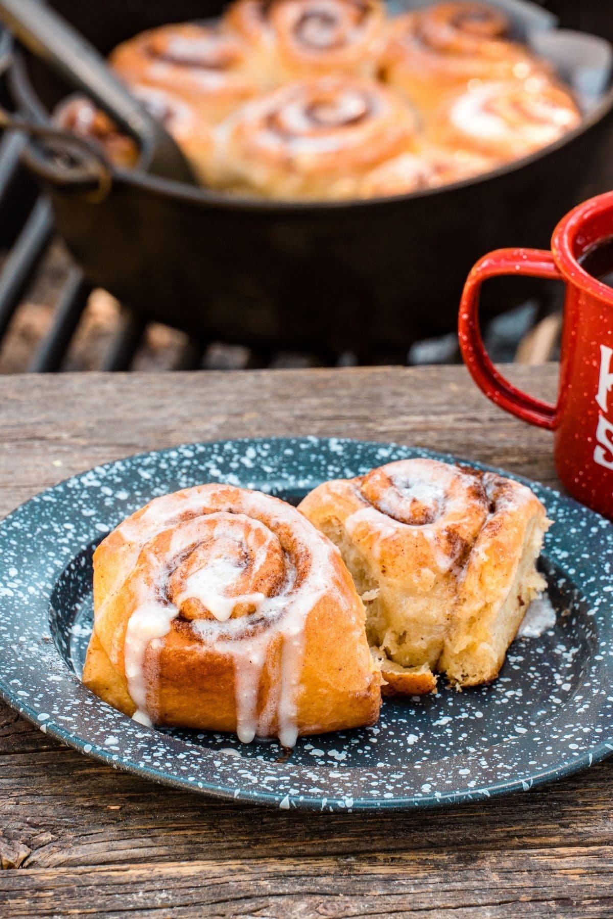 Two cinnamon rolls on a blue plate