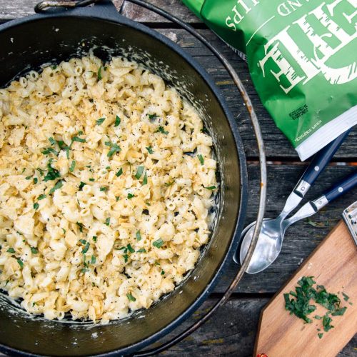 Mac and cheese in a Dutch oven on a picnic table