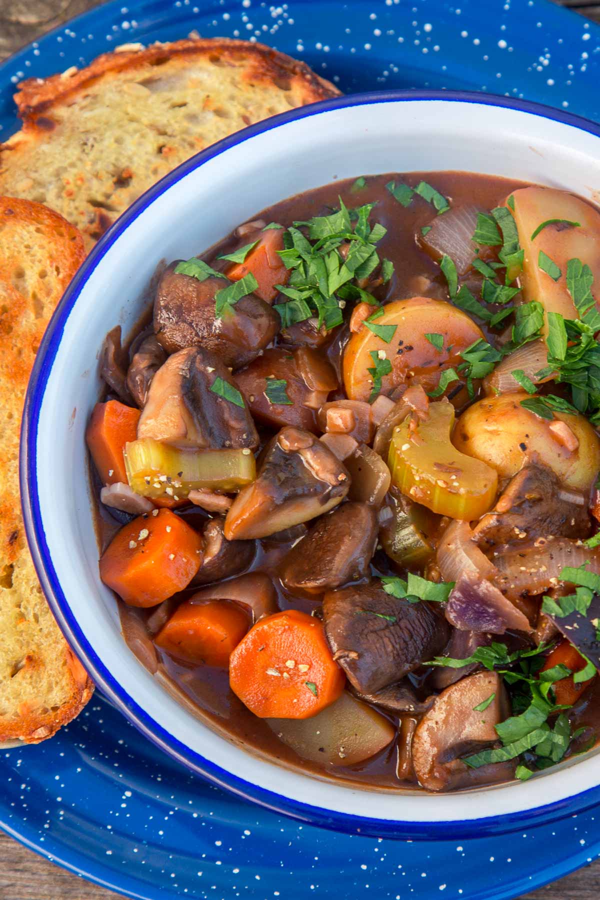 Vegetable stew in a blue and white bowl