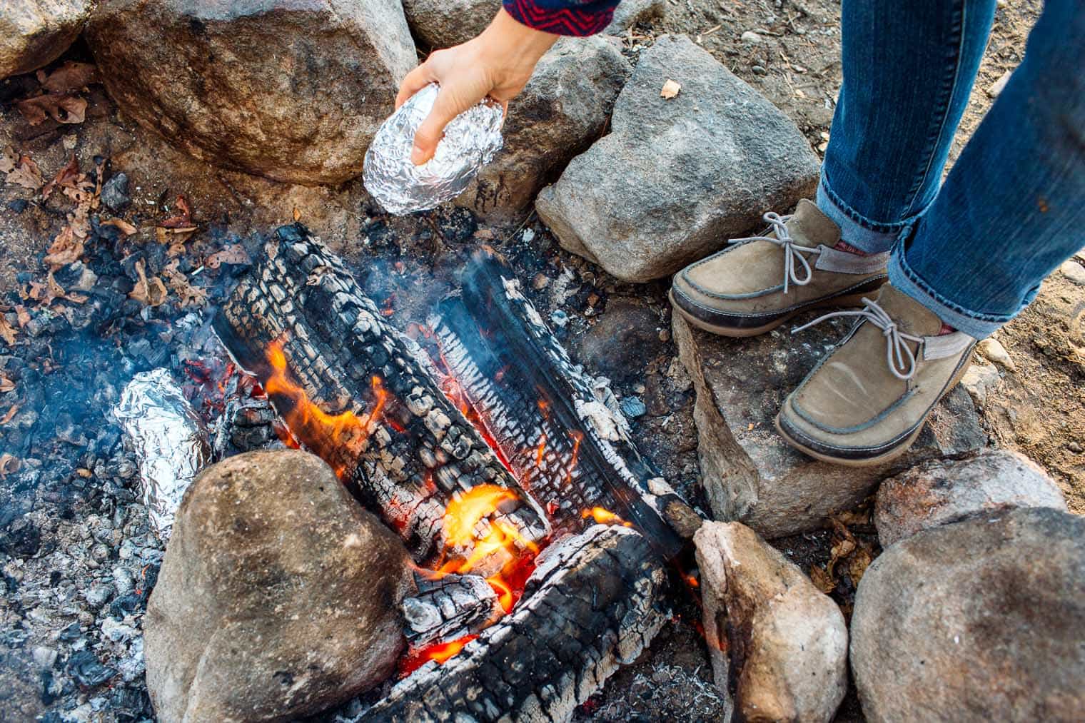 A hearty meal perfect for fall camping trips, this chili stuffed baked sweet potato recipe is easy to make around the campfire.