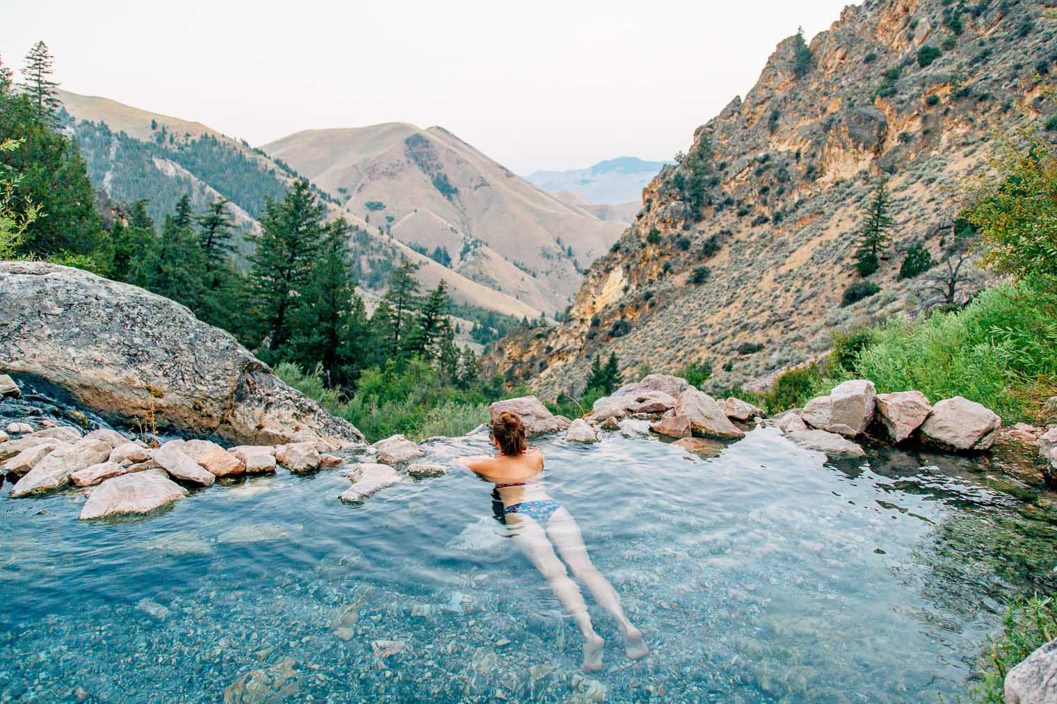 Megan laying in the goldbug Hot Springs in Idaho