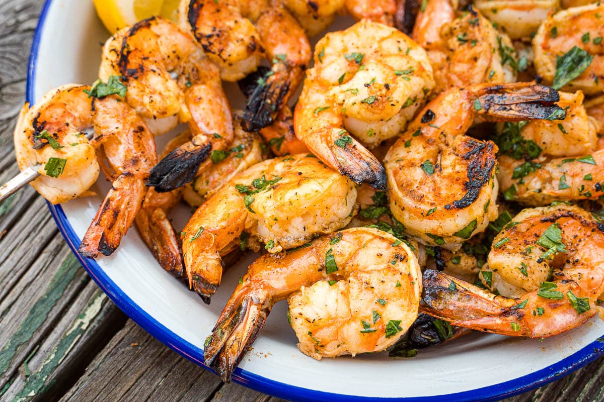 A plate full of grilled shrimp