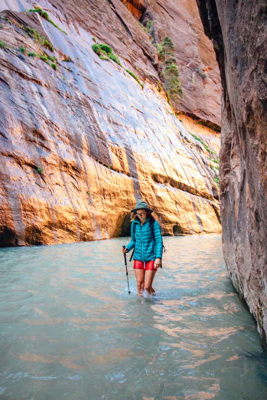 Megan hiking in the river in the Narrows