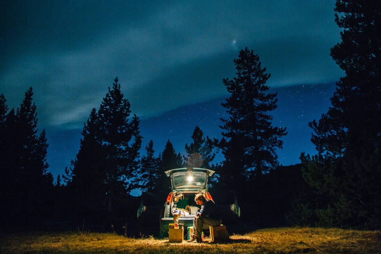 Man cooking a meal at a campsite in Canada