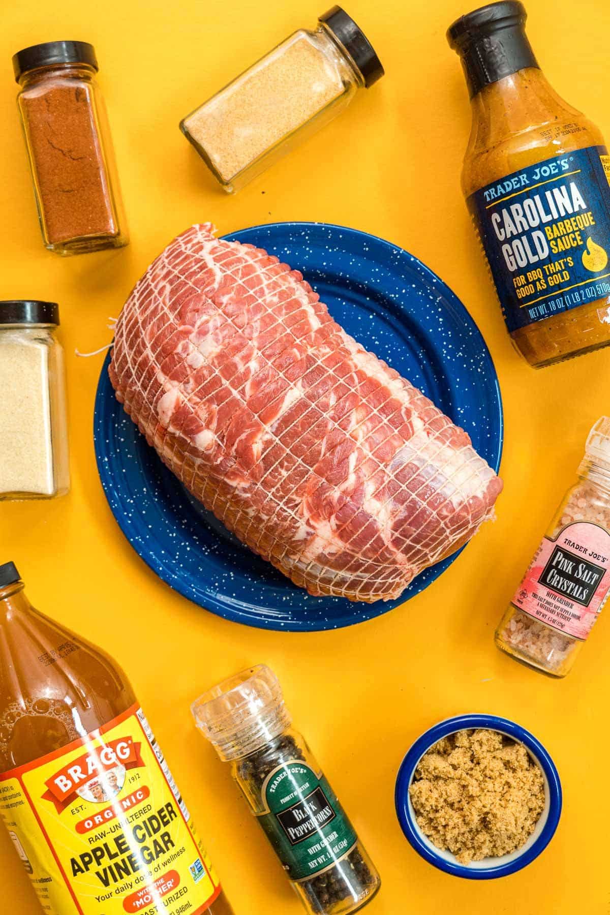 Ingredients for pulled pork arranged on a counter.