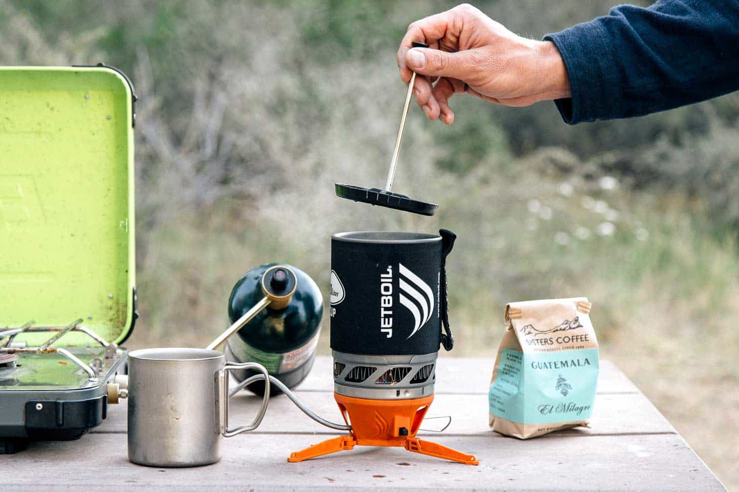 Michael using the jet boil camping coffee press