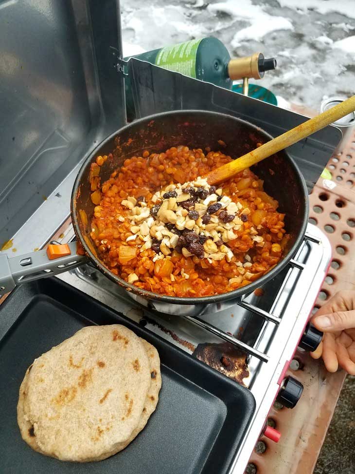 Dhal cooking in a pot on a camping stove