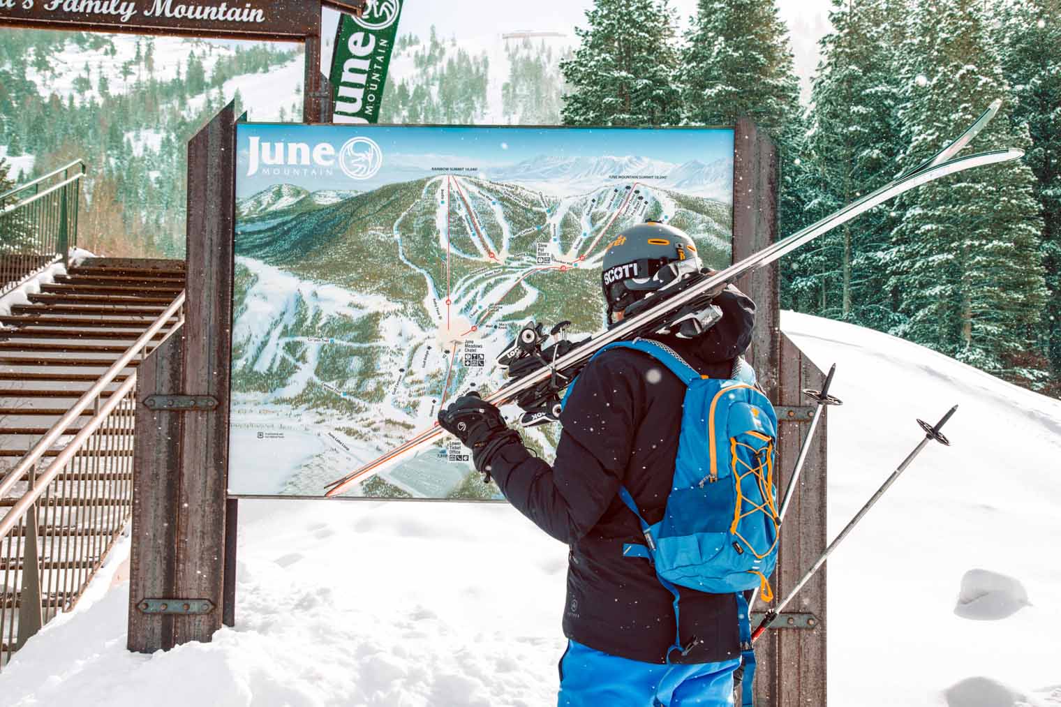 Megan looking at a map of ski hill