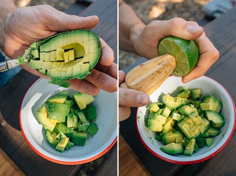 Michael scooping pieces of avocado out of the skin and juicing a lime