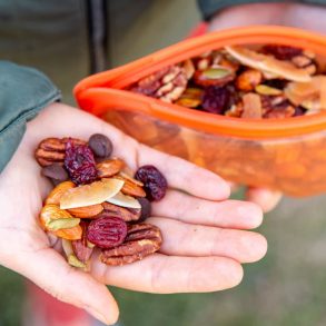 Megan holding a handful of homemade granola