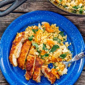 Moroccan spiced chicken on a blue camping plate