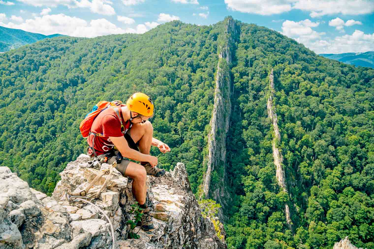 Michael tying his shoes on the NRocks Via Ferrata in West Virginia