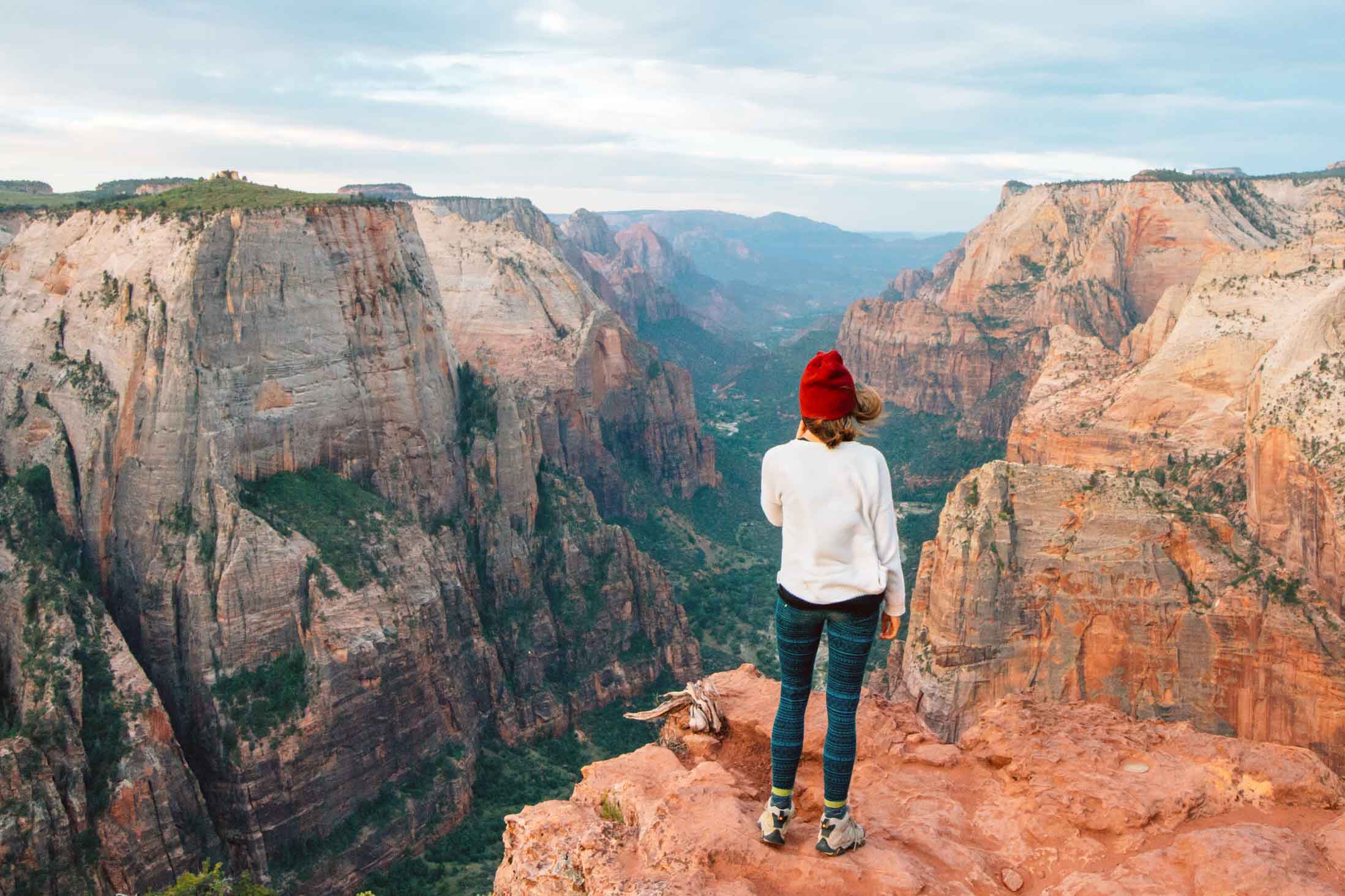 Megan standing on a rock at observation point looking down into Zion Canyon