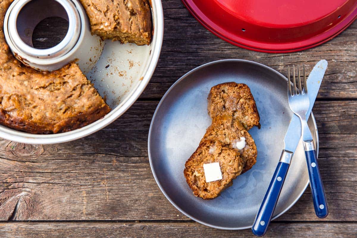 Three slices of banana bread on a plate next to an Omnia oven