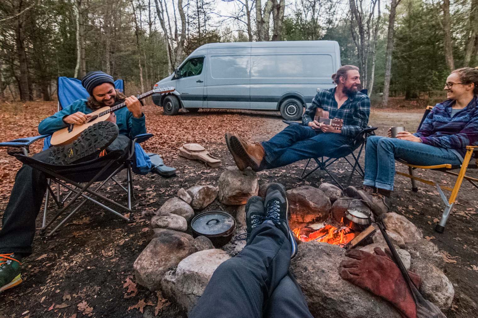 Friends sitting around a campfire