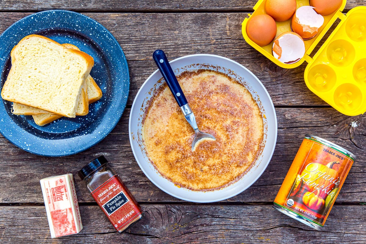 Pumpkin French toast batter in a bowl with other ingredients around it