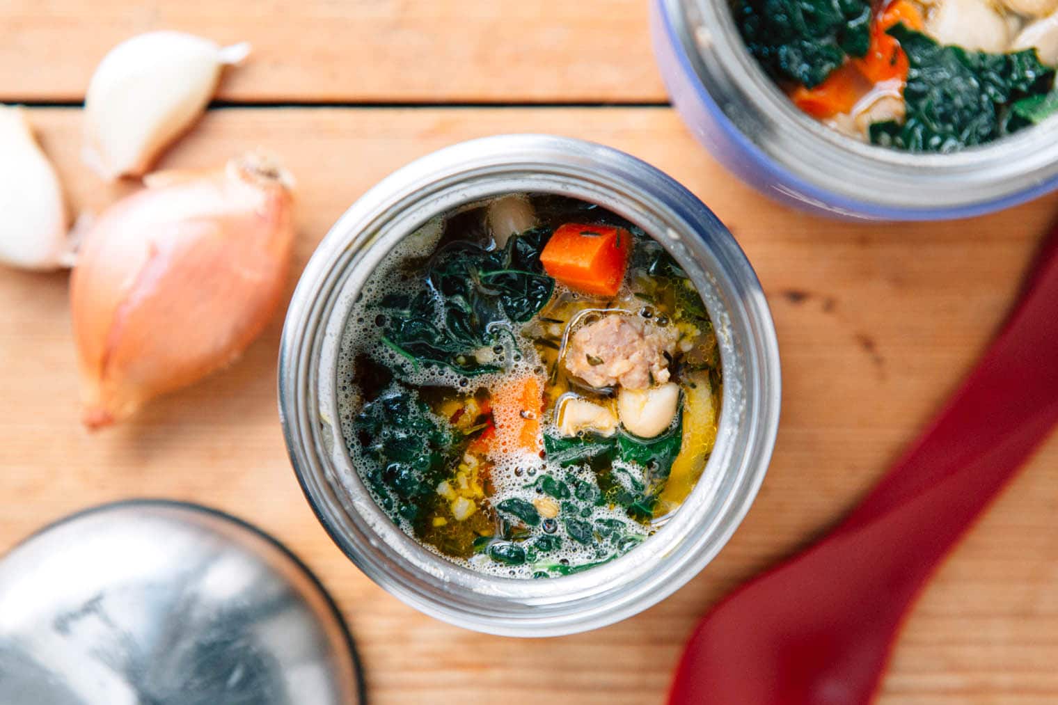 Sausage and bean soup in an insulated container