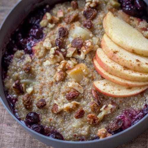 Bowl of quinoa porridge with apples.