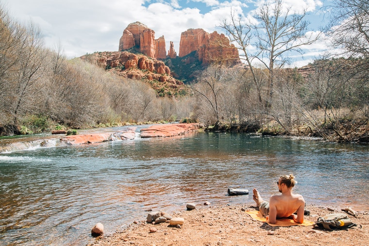 Michael relaxing on a rock next to the red rock creek swimming hole