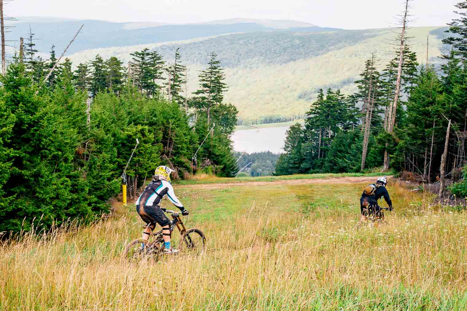 Two men downhill Mountain Biking at Snowshoe in West Virginia