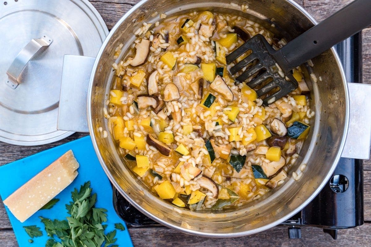 Squash risotto cooking in a pot