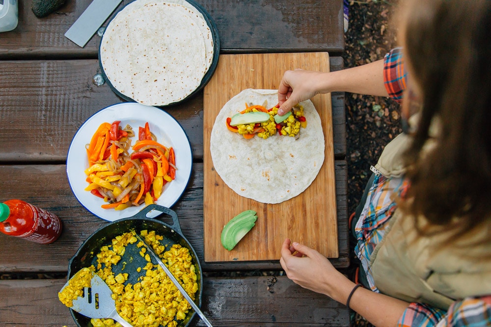 Megan assembling a breakfast burrito