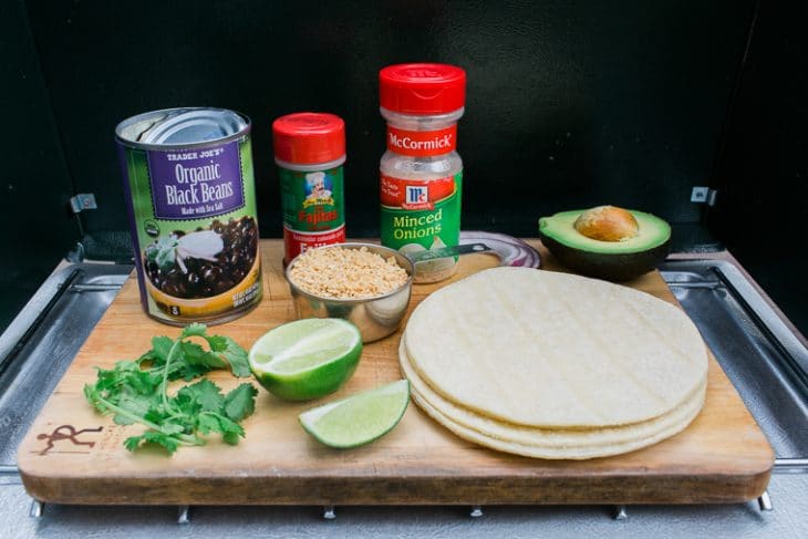 Ingredients for vegan tacos laid out on a cutting board