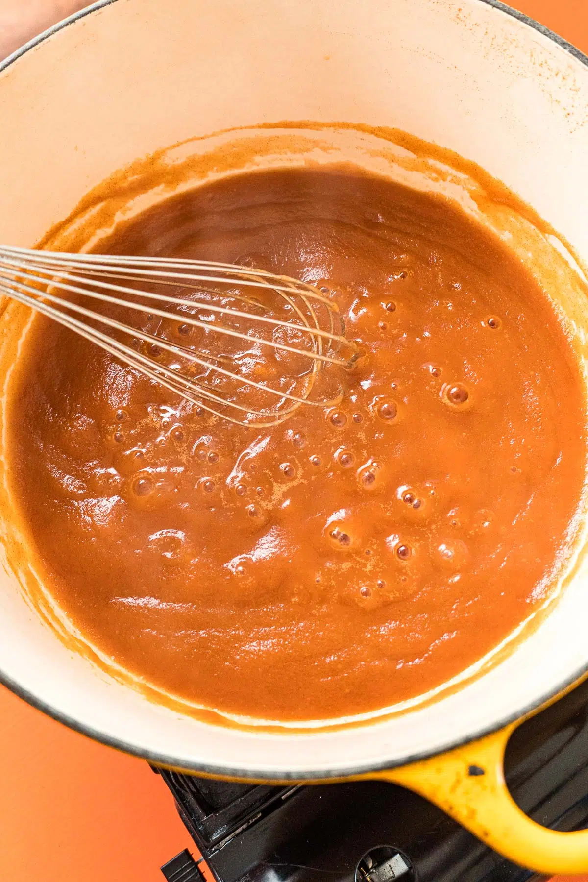 Apple puree cooking in a large pot.