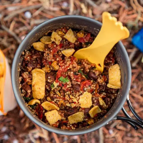 A backpacking pot filled with a burrito bowl backpacking meal