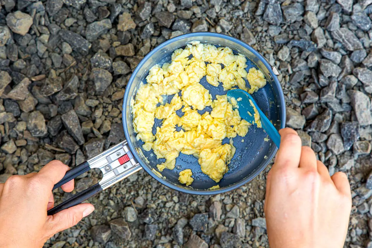 Scrambling ovaeasy eggs in a backpacking pot