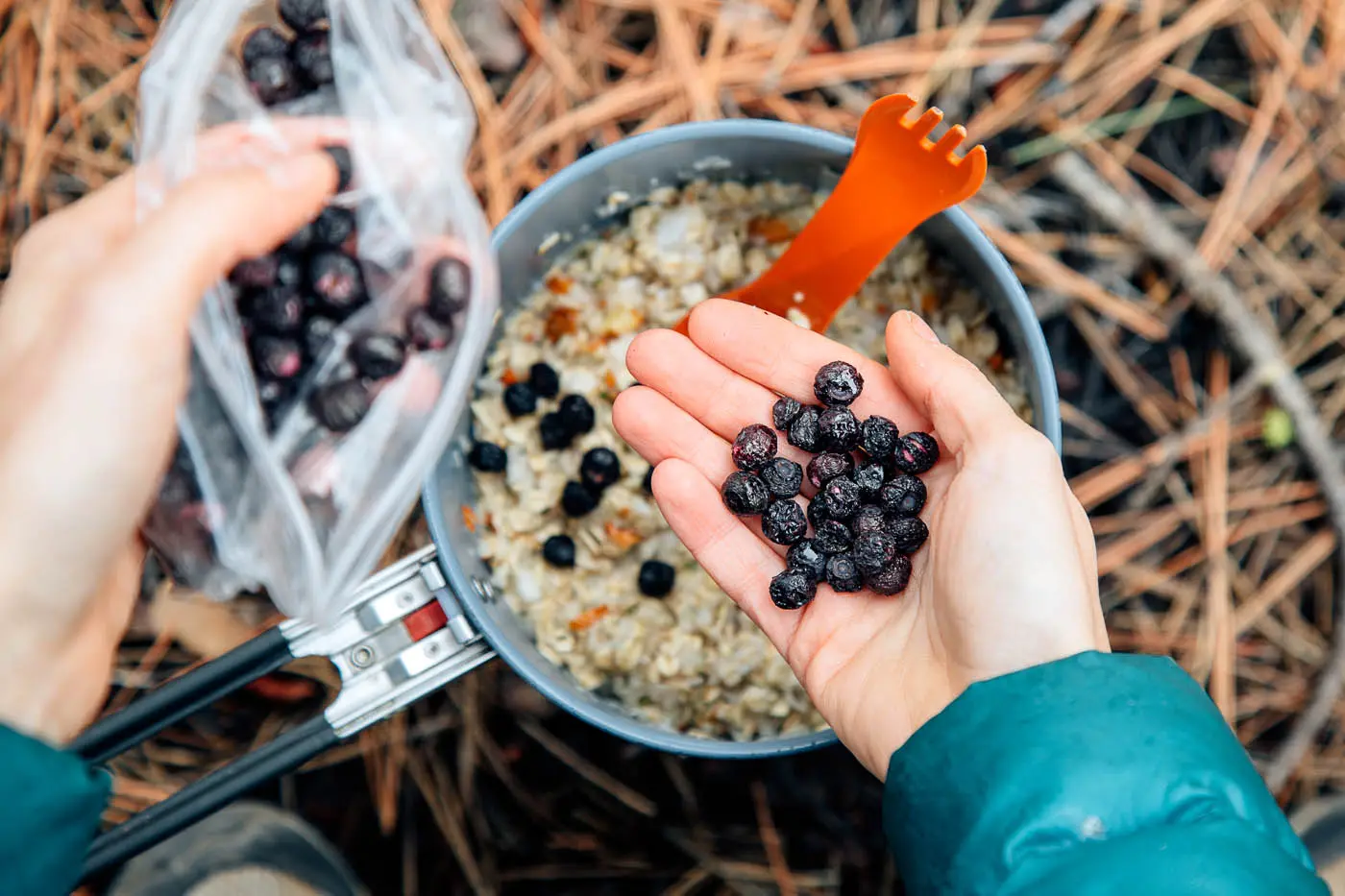 Woman with a handful of blueberries