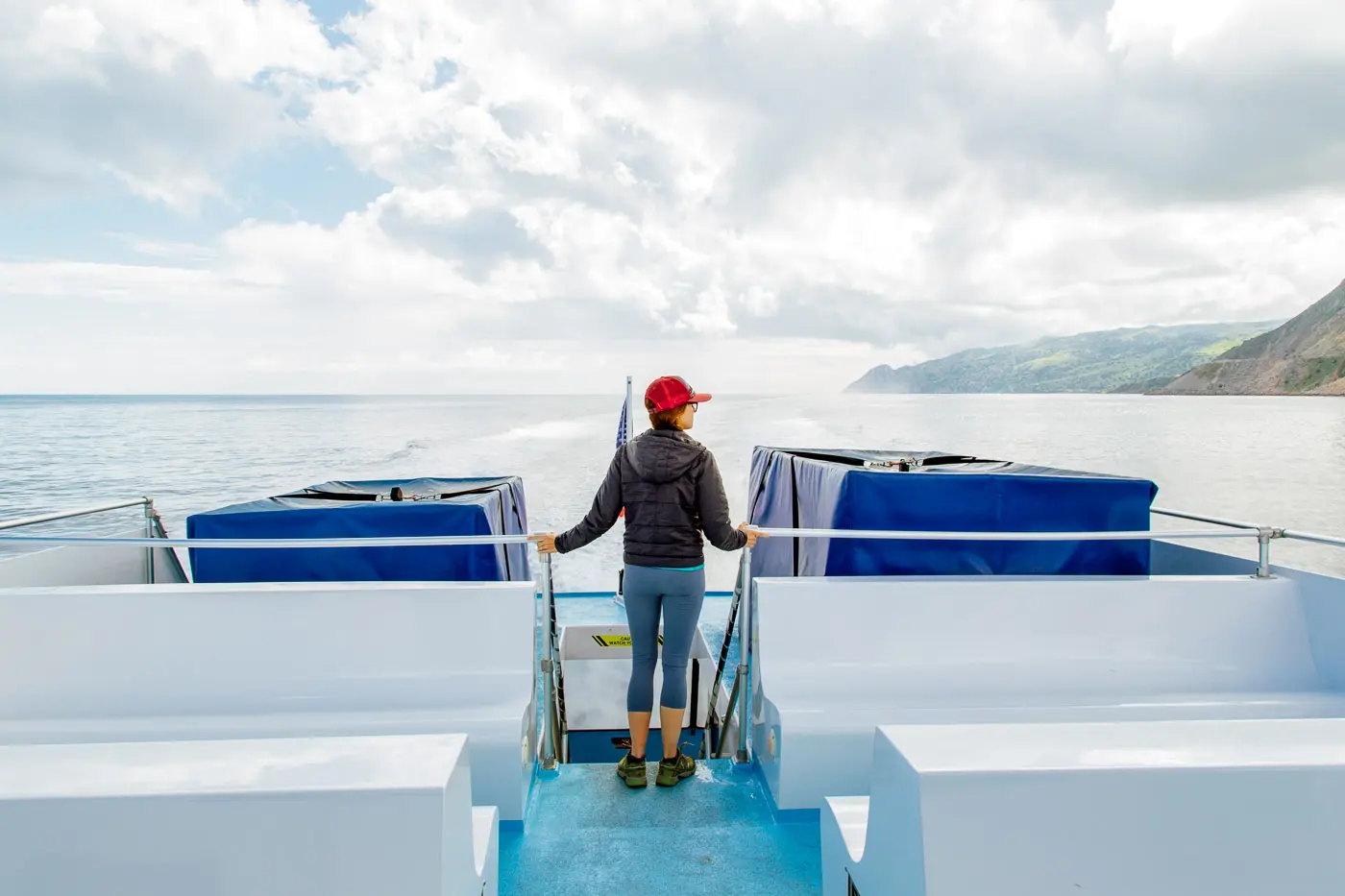 Woman standing on the deck of the Catalina Express ferry boat.