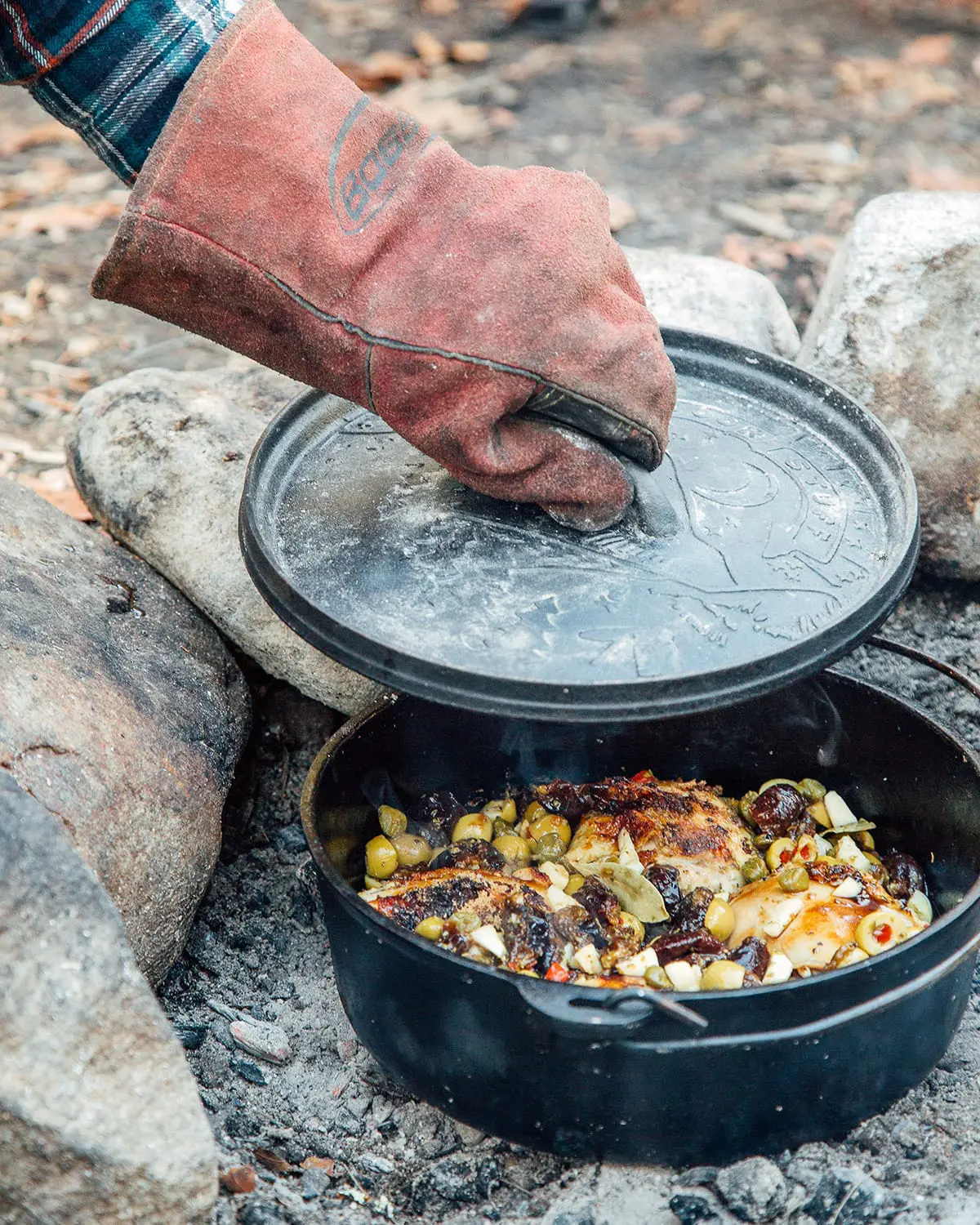 Michael lifting the lid off a Dutch oven