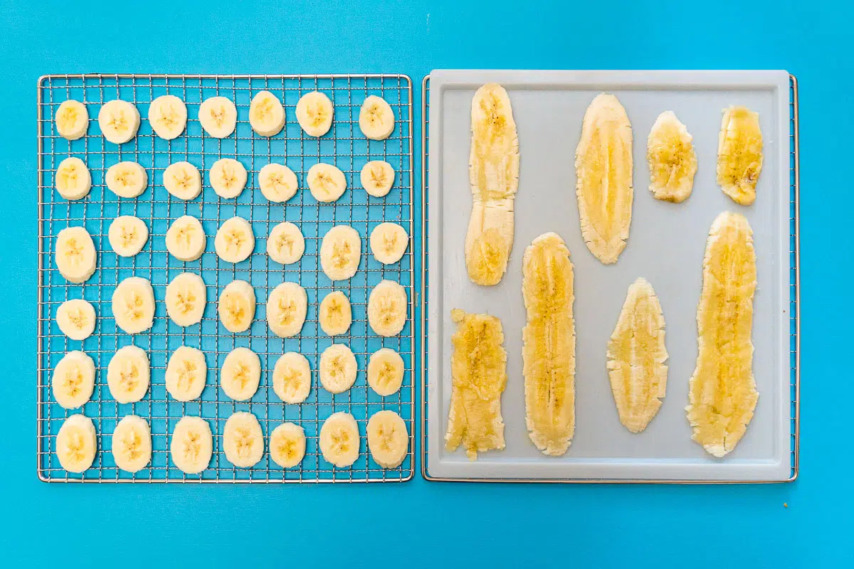 Sliced bananas on dehydrator trays