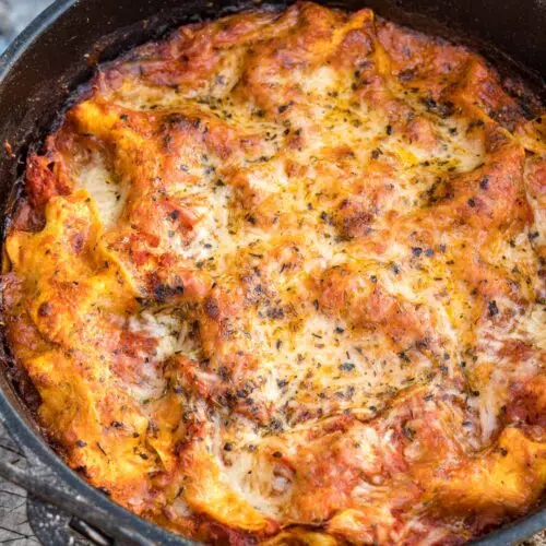 Dutch oven lasagna on a log