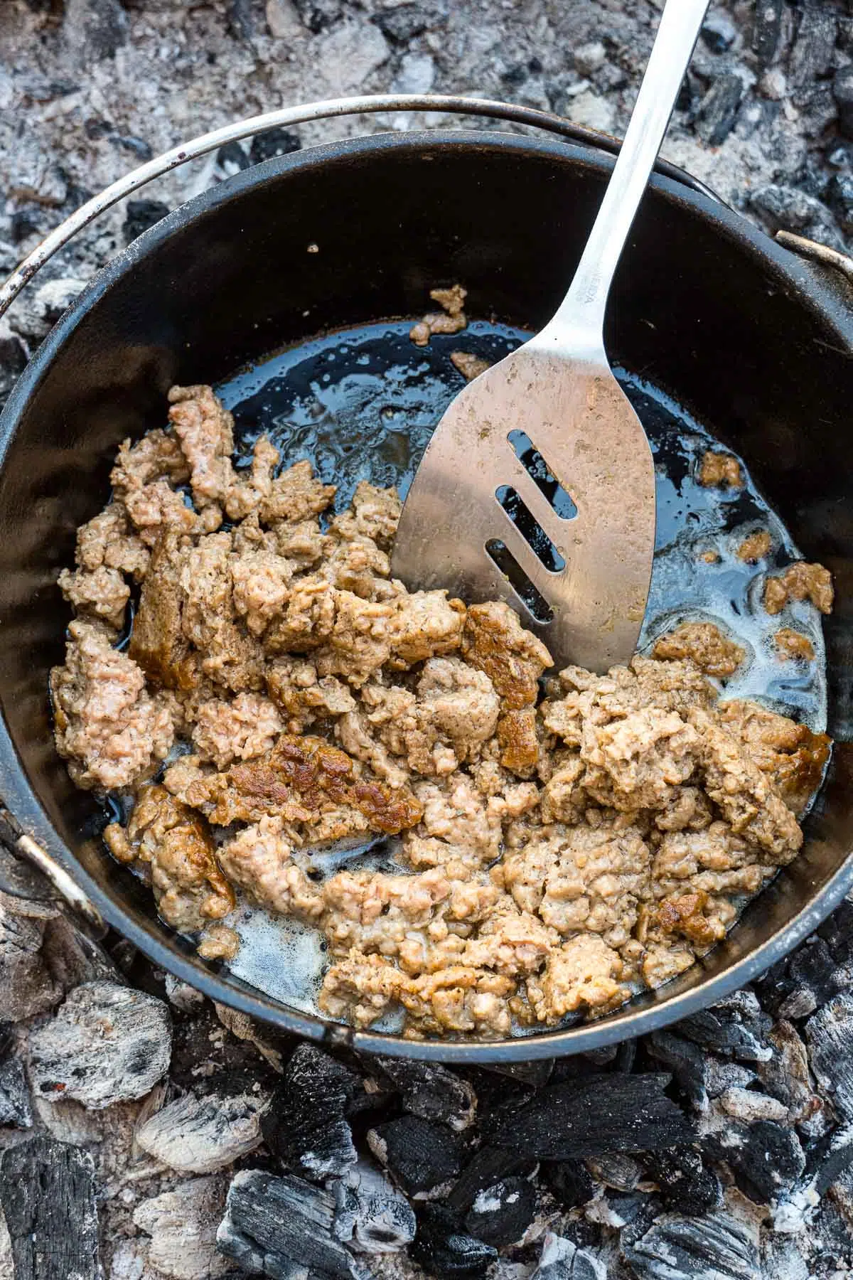 Browning sausage in a Dutch oven.