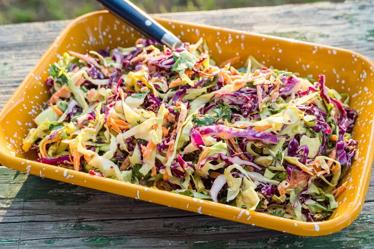 Coleslaw in a yellow dish.