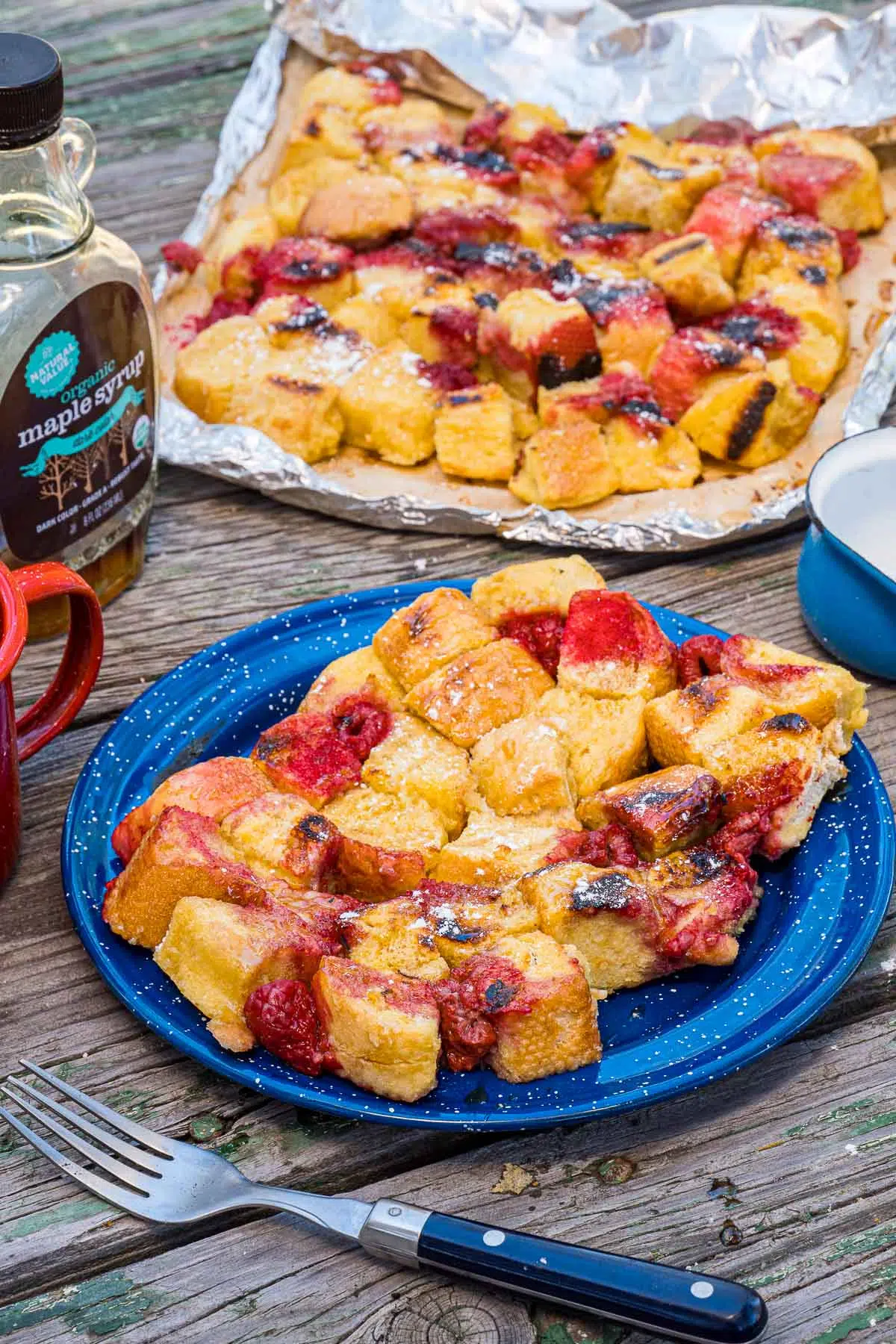 French toast on a blue plate with a foil packet in the background